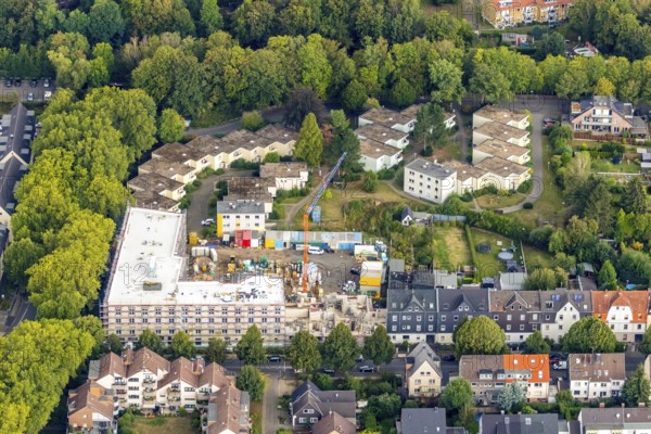 Aerial view, residential quarter with care facility Am Beisenkamp, Wattenscheid, Bochum, Ruhr area, North Rhine-Westphalia, Germany, construction work, building, building area, building site, building plots, building crane, construction project, building site, Bochum-Wattenscheid, DE, Europe, property tax, green trees, real estate, capacity requirements, Koschany und Zimmer Architekten KZA, aerial view, aerial photography, aerial photography, new building, Parkstraße, Wattenscheid district, overview, bird's-eye view, growth, becoming and growing, housing estate, living and living, residential area, residential buildings, residential quality, residential neighbourhood, housing estate, birds-eyes view, overview
