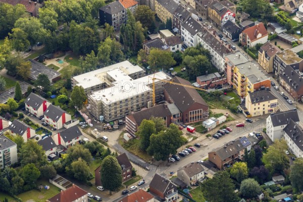Aerial view, construction site new building Ludwig-Steil-Haus, senior centre, Wattenscheid, Bochum, Ruhr area, North Rhine-Westphalia, Germany, retirement home, construction work, building, construction area, building site, building plot, building crane, construction project, construction site, care and nursing, Bochum-Wattenscheid, DE, monument protection, Europe, aerial view, aerial photography, aerial photography, new building, nursing facility, retirement home, retirement residence, retirement home, senior centre Ludwig-Steil GmbH & Co. KG, Wattenscheid district, overview, bird's-eye view, birds-eyes view, overview