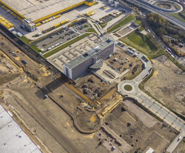 Construction site, new construction DHL Logistik, former Opel site, former Opel administration building, Laer, Bochum, North Rhine-Westphalia, Germany, expansion areas, construction work, building plots, construction measure, DE, monument protection, earthworks, renewal, development, Europe, commercial enterprises, commercial area, commercial park, commercial site, commercial use, freight transport, industrial area, industrial building, industrial site, capacity requirements, logistics, logistics service, logistics service provider, logistics provider, logistics centre, aerial view, aerial photograph, aerial photography, aerial photography, MARK 51°7, Mark 51/7, Opelring, Ruhr area, freight forwarding, transport, transport service, overview, bird's-eye view, growth, becoming and growing, birds-eyes view, overview