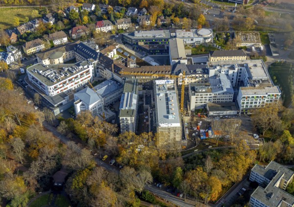 Construction site at St. Josef Hospital Bochum with trees in autumn colours, Bochum, Ruhr area, North Rhine-Westphalia, Germany, construction, construction area, construction site, building plots, construction project, construction site, trees in autumn colours, DE, DEU, development, Europe, healthcare, autumn colours, hospital, clinic, clinic centre, hospital, aerial view, aerial photograph, aerial photography, aerial photography, medical facility, medical aid, overview, bird's eye view, birds-eyes view, overview, medical care