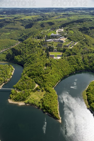 Former Nazi Ordensburg Vogelsang, a building complex erected by the National Socialists on Mount Erpenscheid (1) near Gemünd Eifel above the Urft Dam, Camp Vogelsang former barracks of the Belgian armed forces, Schleiden, Eifel, North Rhine-Westphalia, Germany, Europe, aerial view, birds-eyes view, aerial photography, aerial photography, overview, bird's eye view