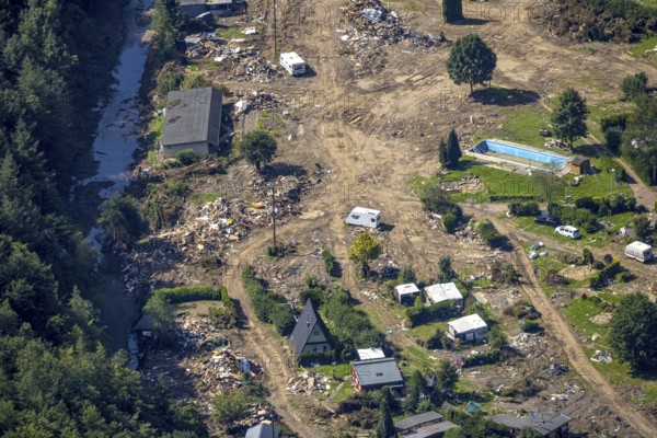 Aerial view, flooded area at the river Ahr and destroyed by flood disaster campsite Sahrtal Ute Vaßmer at the Sahrbach in the district Kreuzberg, Altenahr, Ahr flood, Ahr valley, Rhineland-Palatinate, Germany, camping, camping site, camping houses, camper, campsite, DE, Europe, flood disaster, flood disaster, flood of the century, aerial view, aerial photography, aerial photography, overview, bird's-eye view, motorhome, caravan, birds-eyes view, overview, flooding, flooding, flooded area