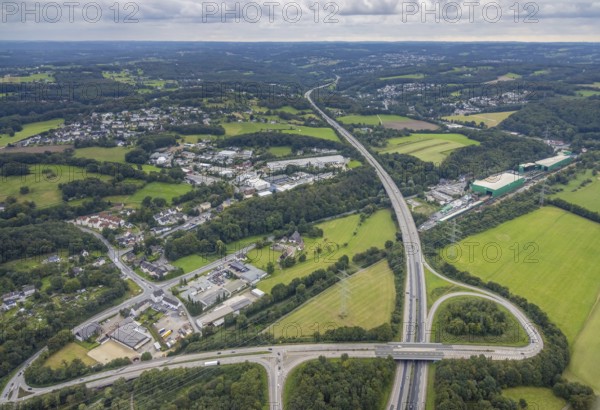 Aerial view, motorway A43 with motorway access Witten-Herbede and commercial area Wittener Straße in the district Westherbede in Witten, Ruhr area, North Rhine-Westphalia, Germany, Bötzel Schrotthandel, DE, Europe, commercial enterprises, commercial area, commercial park, commercial location, commercial use, industrial area, industrial building, industrial location, aerial view, aerial photography, aerial photography, overview, bird's-eye view, meadows and fields, Witten, birds-eyes view, overview