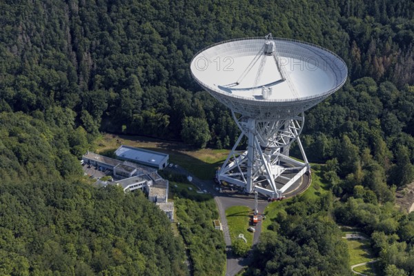 Aerial photograph, Effelsberg radio telescope in the Ahr Mountains in Holzem, Bad Münstereifel, Ahr flood, Ahr Valley, North Rhine-Westphalia, Germany, DE, Eifel part of the Ahr Mountains, Europe, large telescope, cosmos observation, aerial photograph, aerial photography, aerial photography, Max Planck Institute for Radio Astronomy, radio astronomy, radio telescope, overview, bird's-eye view, forest area, space research, birds-eyes view, overview