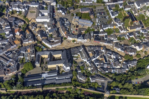Aerial view, historic old town with St. Donatus-Jesuit church and St. Michael-Gymnasium as well as collegiate church St. Chrysanthus and Daria and Bad Münstereifel town hall with destroyed bank area of the Erft after the Erft flood in Bad Münstereifel, Ahr flood, Ahr valley, North Rhine-Westphalia, Germany, place of worship, Bad Münstereifel, authority, education, educational institution, DE, Europe, flood disaster, religious community, place of worship, property tax, grammar school, holy place, flood disaster, real estate, flood of the century, church, parish, denomination, teaching institute, aerial view, aerial photography, aerial photography, town hall, religion, religious site, school, heavy rain, overview, bird's-eye view, living and life, residential area, residential buildings, quality of life, birds-eyes view, overview, flooding