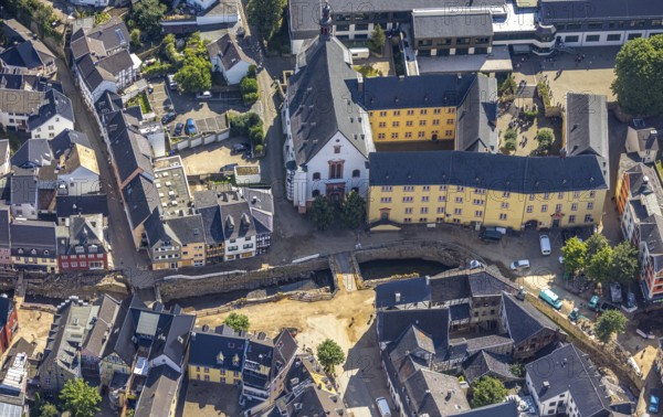 Aerial view, Historic old town with St. Donatus Jesuit Church and St. Michael-Gymnasium and destroyed bank area of the Erft after the Erft flood in Bad Münstereifel, Ahr flood, Ahr valley, North Rhine-Westphalia, Germany, place of worship, Bad Münstereifel, education, educational institution, DE, Europe, flood disaster, religious community, place of worship, property tax, grammar school, holy place, flood disaster, real estate, flood of the century, church, parish, denomination, educational institute, aerial photograph, aerial photography, aerial photography, religion, religious site, school, heavy rain, overview, bird's-eye view, living and life, residential area, residential buildings, quality of life, birds-eyes view, overview, flooding