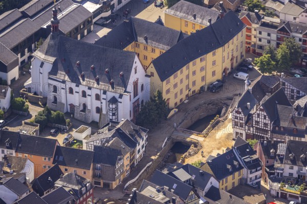 Aerial view, Historic old town with St. Donatus Jesuit Church and St. Michael-Gymnasium and destroyed bank area of the Erft after the Erft flood in Bad Münstereifel, Ahr flood, Ahr valley, North Rhine-Westphalia, Germany, place of worship, Bad Münstereifel, education, educational institution, DE, Europe, flood disaster, religious community, place of worship, property tax, grammar school, holy place, flood disaster, real estate, flood of the century, church, parish, denomination, educational institute, aerial photograph, aerial photography, aerial photography, religion, religious site, school, heavy rain, overview, bird's-eye view, living and life, residential area, residential buildings, quality of life, birds-eyes view, overview, flooding