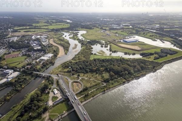 Aerial view, The mouth of the river Lippe into the river Rhine with the Lower Rhine Bridge Wesel at the city harbour in Wesel, Lower Rhine, North Rhine-Westphalia, Germany, federal road B58, DE, Europe, harbour, mouth of the river Lippe, Lippeverband, aerial photograph, aerial photography, aerial photography, estuary, renaturation of the mouth of the river Lippe, sight, overview, bird's-eye view, Wesel, Weseler Straße, birds-eyes view, overview, B58 new, southern bypass Wesel, new road construction, new mouth of the river Lippe