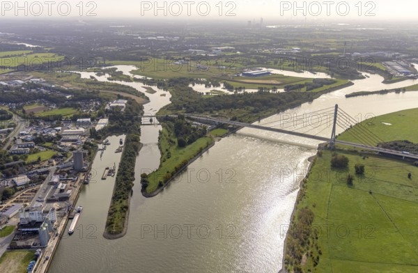 Aerial view, The mouth of the river Lippe into the river Rhine with the Lower Rhine Bridge Wesel at the city harbour in Wesel, Lower Rhine, North Rhine-Westphalia, Germany, federal road B58, DE, Europe, harbour, mouth of the river Lippe, Lippeverband, aerial view, aerial photography, aerial photography, estuary, renaturation of the mouth of the river Lippe, sight, overview, bird's-eye view, Wesel, Weseler Straße, birds-eyes view, overview