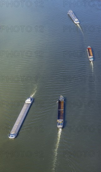 Aerial view, inland navigation on the river Rhine in the district Büderich in Wesel, Lower Rhine, North Rhine-Westphalia, Germany, inland navigation, DE, Europe, goods transport, goods traffic, cargo ships, aerial view, aerial photography, aerial photography, renaturation of the Lippe estuary, shipping traffic, overview, bird's eye view, Wesel, birds-eyes view, overview
