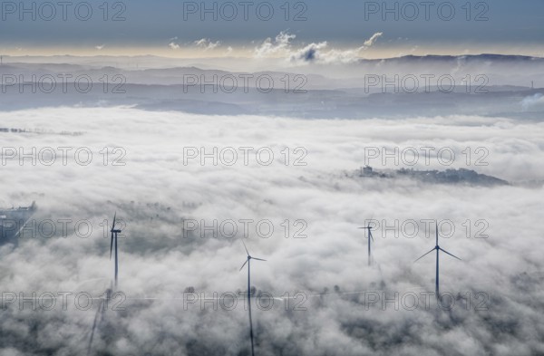 Aerial view, wind turbines in the fog and mountains of the Sauerland in the backlight in the district Wiehagen in Wickede, Sauerland, North Rhine-Westphalia, Germany, mountains, DE, Europe, shapes and colours, aerial view, aerial photography, aerial photography, fog, overview, bird's-eye view, WEA, Wickede, wind energy, wind turbine, wind power, wind turbine, wind turbines, clouds, birds-eyes view, overview
