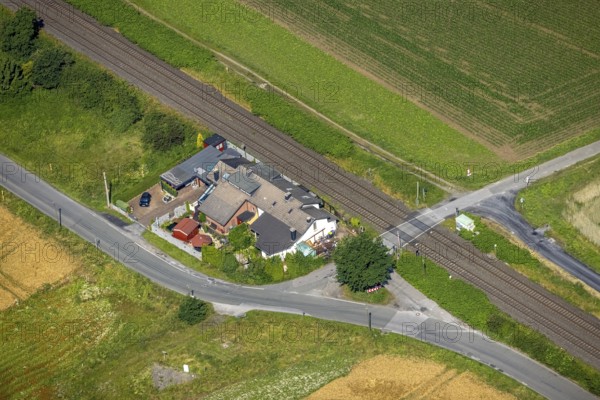 Aerial view, residential house at Wickeder Straße level crossing, Wimbern, Wickede, Sauerland, North Rhine-Westphalia, Germany, railway tracks, level crossing, DE, Europe, aerial view, aerial photography, aerial photography, overview, bird's-eye view, overview