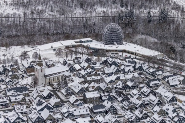 Aerial view of the snowy winter landscape of Winterberg with deserted streets during the corona lockdown in the Sauerland in North Rhine-Westphalia, Germany, Sauerland, Europe, aerial photo, birds-eyes view, aerial photography, aerial photography, overview, bird's eye view, lockdown, closed winter landscape, corona lockdown, deserted, snow, winter weather, corona-related lockdown
