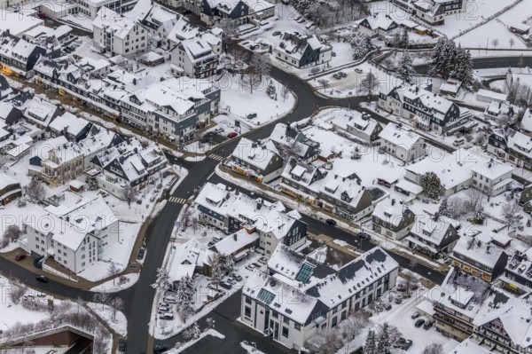 Aerial view of the snowy winter landscape of Winterberg with deserted streets during the corona lockdown in the Sauerland in North Rhine-Westphalia, Germany, Sauerland, Europe, aerial photo, birds-eyes view, aerial photography, aerial photography, overview, bird's eye view, lockdown, closed winter landscape, corona lockdown, deserted, snow, winter weather, corona-related lockdown