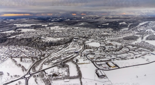 Aerial view of the snowy winter landscape of Winterberg with deserted streets during the corona lockdown in the Sauerland in North Rhine-Westphalia, Germany, Sauerland, Europe, aerial photo, birds-eyes view, aerial photography, aerial photography, overview, bird's eye view, lockdown, closed winter landscape, corona lockdown, deserted, snow, winter weather, corona-related lockdown