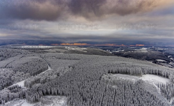 Aerial view of the snowy winter landscape of Winterberg in Sauerland in North Rhine-Westphalia, Germany, Sauerland, Europe, aerial photo, birds-eyes view, aerial photography, aerial photography, overview, bird's eye view, lockdown, closed winter landscape, corona lockdown, deserted, snow, winter weather, corona-related lockdown