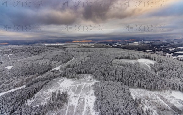 Aerial view of the snowy winter landscape of Winterberg in Sauerland in North Rhine-Westphalia, Germany, Sauerland, Europe, aerial photo, birds-eyes view, aerial photography, aerial photography, overview, bird's eye view, lockdown, closed winter landscape, corona lockdown, deserted, snow, winter weather, corona-related lockdown