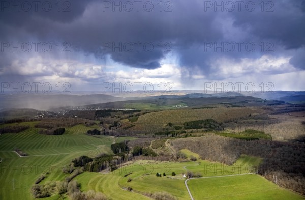 Aerial view, clouds over the forest area near Wilgersdorf, Wilnsdorf, Siegerland, North Rhine-Westphalia, Germany, DE, Europe, hilly landscape, Siegen-Wittgenstein district, aerial view, aerial photography, aerial photography, overview, bird's-eye view, weather phenomena, meadows and fields, cloud formation, birds-eyes view, overview