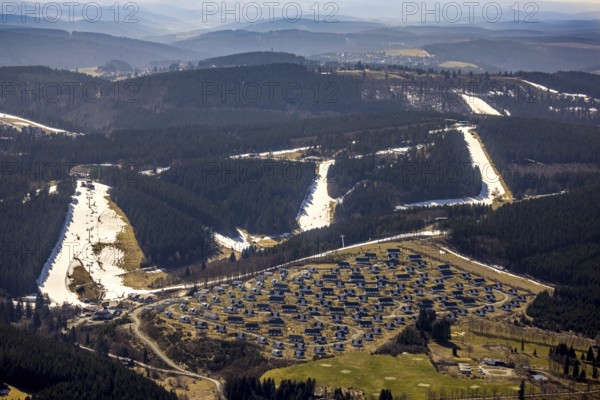 Landal Ferienpark Winterberg, Winterberg, Sauerland, North Rhine-Westphalia, Germany, DE, Europe, distant view, hilly landscape, aerial view, aerial photograph, aerial photography, aerial photography, pandemic lockdown, terraced houses, snow remains, overview, bird's eye view, forest area, winter, residential complex, residential park, housing estate, birds-eyes view, overview