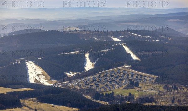Landal Ferienpark Winterberg, Winterberg, Sauerland, North Rhine-Westphalia, Germany, DE, Europe, distant view, hilly landscape, aerial view, aerial photograph, aerial photography, aerial photography, pandemic lockdown, terraced houses, snow remains, overview, bird's eye view, forest area, winter, residential complex, residential park, housing estate, birds-eyes view, overview