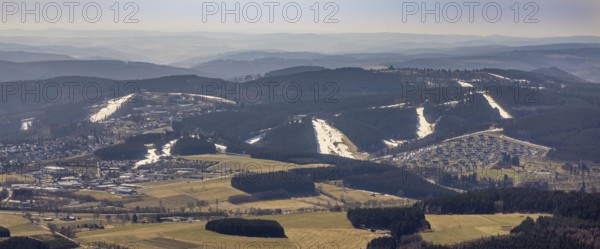 Landal Ferienpark Winterberg, Winterberg, Sauerland, North Rhine-Westphalia, Germany, DE, Europe, distant view, hilly landscape, aerial view, aerial photograph, aerial photography, aerial photography, pandemic lockdown, terraced houses, snow remains, overview, bird's eye view, forest area, winter, residential complex, residential park, housing estate, birds-eyes view, overview