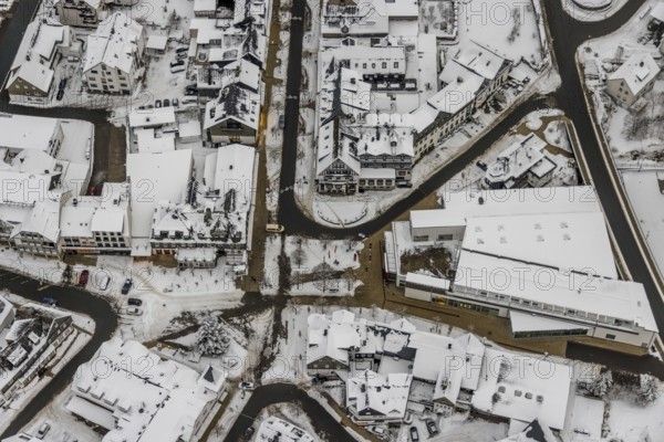 Aerial view of the snowy winter landscape of Winterberg with deserted streets at the market in the centre of Winterberg during the corona lockdown in Sauerland in North Rhine-Westphalia, Germany, Sauerland, Europe, aerial photo, birds-eyes view, aerial photography, aerial photography, overview, bird's eye view, lockdown, closed winter landscape, corona lockdown, deserted, snow, winter weather, corona-related lockdown
