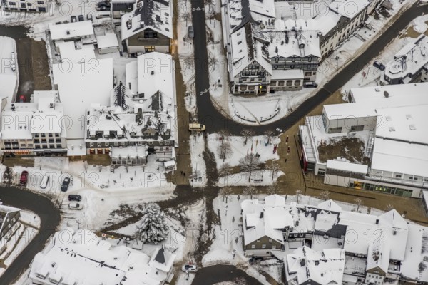 Aerial view of the snowy winter landscape of Winterberg with deserted streets at the market in the centre of Winterberg during the corona lockdown in Sauerland in North Rhine-Westphalia, Germany, Sauerland, Europe, aerial photo, birds-eyes view, aerial photography, aerial photography, overview, bird's eye view, lockdown, closed winter landscape, corona lockdown, deserted, snow, winter weather, corona-related lockdown