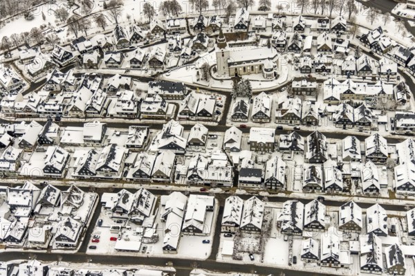 Aerial view of the snowy winter landscape of Winterberg with deserted streets during the Corona lockdown with the Catholic Church Winterberg in Sauerland in North Rhine-Westphalia, Germany, Sauerland, Europe, aerial photo, birds-eyes view, aerial photography, aerial photography, overview, bird's eye view, lockdown, closed winter landscape, corona lockdown, deserted, snow, winter weather, corona-related lockdown