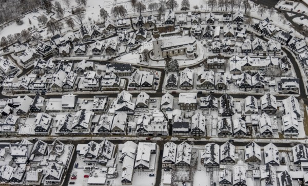 Aerial view of the snowy winter landscape of Winterberg with deserted streets during the Corona lockdown with the Catholic Church Winterberg in Sauerland in North Rhine-Westphalia, Germany, Sauerland, Europe, aerial photo, birds-eyes view, aerial photography, aerial photography, overview, bird's eye view, lockdown, closed winter landscape, corona lockdown, deserted, snow, winter weather, corona-related lockdown