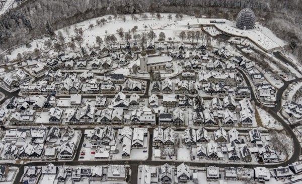 Aerial view of the snowy winter landscape of Winterberg with deserted streets during the Corona lockdown with the Catholic Church Winterberg in Sauerland in North Rhine-Westphalia, Germany, Sauerland, Europe, aerial photo, birds-eyes view, aerial photography, aerial photography, overview, bird's eye view, lockdown, closed winter landscape, corona lockdown, deserted, snow, winter weather, corona-related lockdown