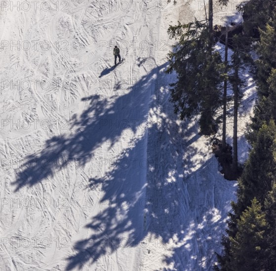 Snowboarder on ski slope, Winterberg, Sauerland, North Rhine-Westphalia, Germany, DE, Europe, aerial view, aerial photography, aerial photography, pandemic lockdown, snow remains, overview, bird's eye view, winter, birds-eyes view, overview