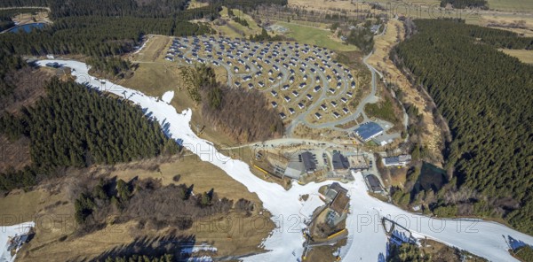 Landal Ferienpark Winterberg, Winterberg, Sauerland, North Rhine-Westphalia, Germany, DE, Europe, distant view, hilly landscape, aerial view, aerial photograph, aerial photography, aerial photography, pandemic lockdown, terraced houses, snow remains, overview, bird's eye view, forest area, winter, residential complex, residential park, housing estate, birds-eyes view, overview