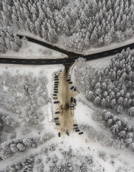 Aerial view of the snowy winter landscape of Winterberg with car park Helleplatz at Kahlen Asten in Sauerland in North Rhine-Westphalia, Germany, Sauerland, Europe, aerial view, birds-eyes view, aerial photography, aerial photography, overview, bird's eye view, lockdown, closed winter landscape, corona lockdown, deserted, snow, winter weather, corona-related lockdown