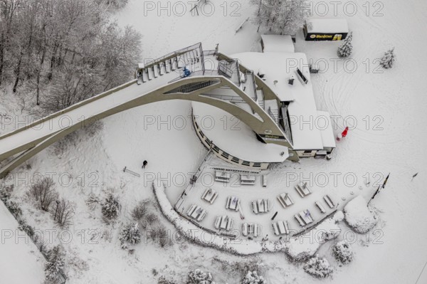 Aerial view of the snowy winter landscape of Winterberg with the St. Georg ski jump in the Sauerland in North Rhine-Westphalia, Germany, Sauerland, Europe, aerial photo, birds-eyes view, aerial photography, aerial photography, overview, bird's eye view, lockdown, closed winter landscape, corona lockdown, deserted, snow, winter weather, corona-related lockdown