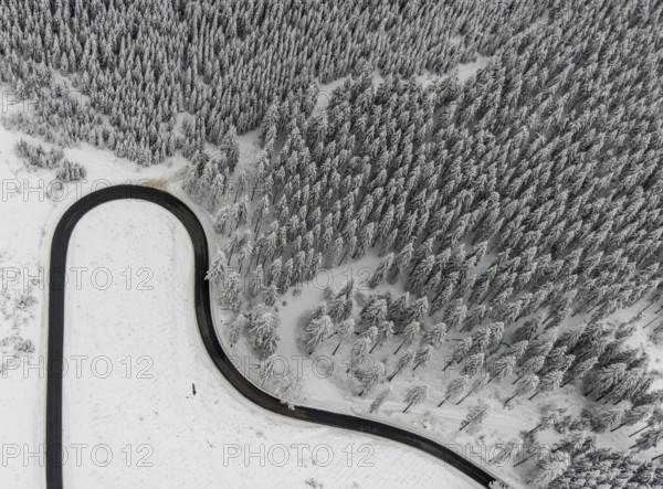 Aerial view of the snowy winter landscape of Winterberg with winding roads and paths in the Sauerland in North Rhine-Westphalia, Germany, Sauerland, Europe, aerial photo, birds-eyes view, aerial photography, aerial photography, overview, bird's eye view, lockdown, closed winter landscape, corona lockdown, deserted, snow, winter weather, corona-related lockdown