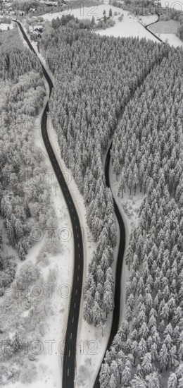 Aerial view of the snowy winter landscape of Winterberg with winding roads and paths in the Sauerland in North Rhine-Westphalia, Germany, Sauerland, Europe, aerial photo, birds-eyes view, aerial photography, aerial photography, overview, bird's eye view, lockdown, closed winter landscape, corona lockdown, deserted, snow, winter weather, corona-related lockdown