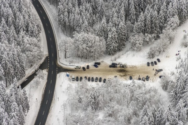 Aerial view of the snowy winter landscape of Winterberg with car park Helleplatz at Kahlen Asten in Sauerland in North Rhine-Westphalia, Germany, Sauerland, Europe, aerial view, birds-eyes view, aerial photography, aerial photography, overview, bird's eye view, lockdown, closed winter landscape, corona lockdown, deserted, snow, winter weather, corona-related lockdown