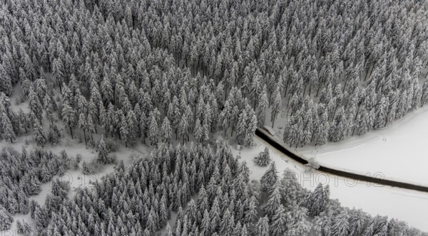Aerial view of the snowy winter landscape of Winterberg with winding roads and paths in the Sauerland in North Rhine-Westphalia, Germany, Sauerland, Europe, aerial photo, birds-eyes view, aerial photography, aerial photography, overview, bird's eye view, lockdown, closed winter landscape, corona lockdown, deserted, snow, winter weather, corona-related lockdown