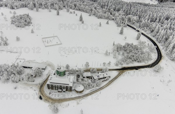 Aerial view of the snowy winter landscape of Winterberg am Kahlen Asten with Astenturm during Corona times in Sauerland in North Rhine-Westphalia, Germany, Sauerland, Europe, aerial view, birds-eyes view, aerial photography, aerial photography, overview, bird's eye view, lockdown, closed winter landscape, corona lockdown, deserted, snow, winter weather, corona-related lockdown, high heath in winter