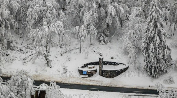 Aerial view of the snowy winter landscape of Winterberg below the Kahler Asten with snow-covered trees and firs in the Sauerland in North Rhine-Westphalia, Germany, Sauerland, Europe, aerial photo, birds-eyes view, aerial photography, aerial photography, overview, bird's eye view, lockdown, closed winter landscape, corona lockdown, deserted, snow, winter weather, corona-related lockdown, high heath in winter
