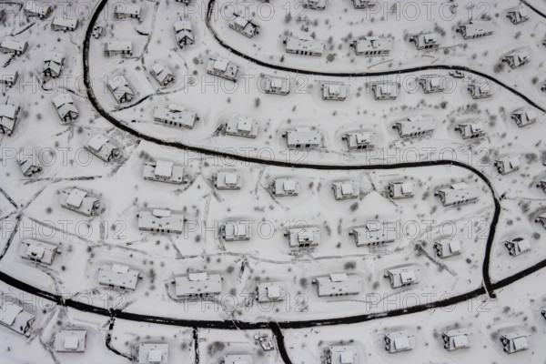 Aerial view of the snowy winter landscape of Winterberg with the deserted Landal Winterberg holiday resort in the Corona Lockdown in Sauerland in North Rhine-Westphalia, Germany, Sauerland, Europe, aerial photo, birds-eyes view, aerial photography, aerial photography, overview, bird's eye view, lockdown, closed winter landscape, corona lockdown, deserted, snow, winter weather, corona-related lockdown