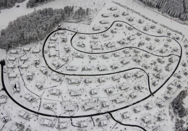 Aerial view of the snowy winter landscape of Winterberg with the deserted Landal Winterberg holiday resort in the Corona Lockdown in Sauerland in North Rhine-Westphalia, Germany, Sauerland, Europe, aerial photo, birds-eyes view, aerial photography, aerial photography, overview, bird's eye view, lockdown, closed winter landscape, corona lockdown, deserted, snow, winter weather, corona-related lockdown