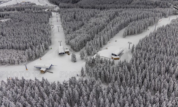 Aerial view of the snowy winter landscape of Winterberg with deserted ski lifts and slopes during the corona-related lockdown in the Sauerland in North Rhine-Westphalia, Germany, Sauerland, Europe, aerial photo, birds-eyes view, aerial photography, aerial photography, overview, bird's eye view, lockdown, closed winter landscape, corona lockdown, deserted, snow, winter weather, corona-related lockdown, high heath in winter
