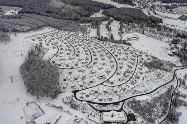 Aerial view of the snowy winter landscape of Winterberg with the deserted Landal Winterberg holiday resort in the Corona Lockdown in Sauerland in North Rhine-Westphalia, Germany, Sauerland, Europe, aerial photo, birds-eyes view, aerial photography, aerial photography, overview, bird's eye view, lockdown, closed winter landscape, corona lockdown, deserted, snow, winter weather, corona-related lockdown