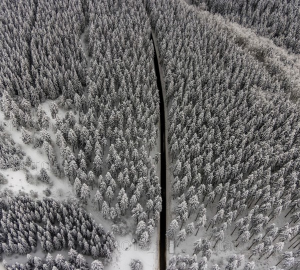 Aerial view of the snowy winter landscape of Winterberg with winding roads and paths in the Sauerland in North Rhine-Westphalia, Germany, Sauerland, Europe, aerial photo, birds-eyes view, aerial photography, aerial photography, overview, bird's eye view, lockdown, closed winter landscape, corona lockdown, deserted, snow, winter weather, corona-related lockdown