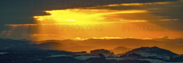 Aerial view of the sunset with a view over the snowy winter landscape from Winterberg to the Bergisches Land in Sauerland in North Rhine-Westphalia, Germany, Sauerland, Europe, aerial view, birds-eyes view, aerial photography, aerial photography, overview, bird's eye view, lockdown, closed winter landscape, corona lockdown, deserted, snow, winter weather, corona-related lockdown