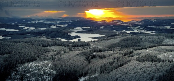 Aerial view of the sunset with a view over the snowy winter landscape from Winterberg to the Bergisches Land in Sauerland in North Rhine-Westphalia, Germany, Sauerland, Europe, aerial view, birds-eyes view, aerial photography, aerial photography, overview, bird's eye view, lockdown, closed winter landscape, corona lockdown, deserted, snow, winter weather, corona-related lockdown