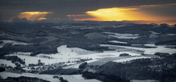 Aerial view of the sunset with a view over the snowy winter landscape from Winterberg to the Bergisches Land in Sauerland in North Rhine-Westphalia, Germany, Sauerland, Europe, aerial view, birds-eyes view, aerial photography, aerial photography, overview, bird's eye view, lockdown, closed winter landscape, corona lockdown, deserted, snow, winter weather, corona-related lockdown