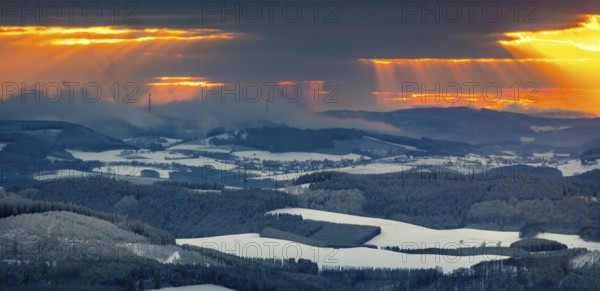 Aerial view of the sunset with a view over the snowy winter landscape from Winterberg to the Bergisches Land in Sauerland in North Rhine-Westphalia, Germany, Sauerland, Europe, aerial view, birds-eyes view, aerial photography, aerial photography, overview, bird's eye view, lockdown, closed winter landscape, corona lockdown, deserted, snow, winter weather, corona-related lockdown