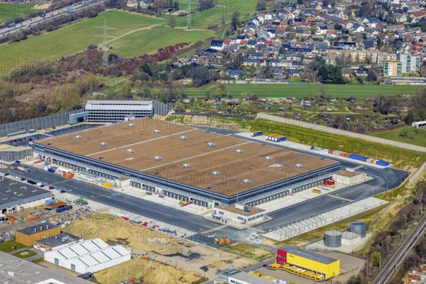 Aerial view, construction site new building Amazon logistics centre, industrial estate on Brauckstraße, allotment garden site Mellmausland, Rüdinghausen, Witten, Ruhr area, North Rhine-Westphalia, Germany, Amazon logistics centre, railway tracks, construction work, construction area, building site, building plots, construction measure, construction project, building site, DE, Ennepe-Ruhr district, development, Europe, community garden, commercial enterprises, commercial area, commercial park, commercial site, commercial use, freight traffic, industrial estate, industrial building, industrial site, allotment garden, allotment garden site, allotment garden association, allotment gardener association, logistics, logistics service, logistics provider, logistics centre, aerial view, aerial photography, aerial photography, Menglinghauser Straße, new build, parcel delivery, Salinger Feld, allotment garden, freight forwarding, transport, transport service, overview, bird's-eye view, overview
